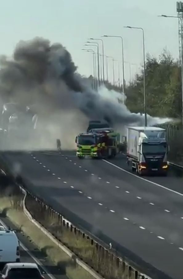 Thick black smoke billowed into the air after a fire on the M62