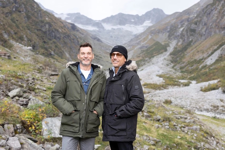 Fred Sirieix and Gino D'Acampo in a mountain landscape.