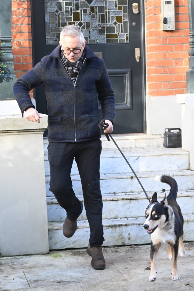 The former England striker broke cover and went out for a stroll with his dog today