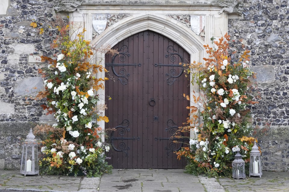 Autumnal floral displays were set up around the doorways of the church