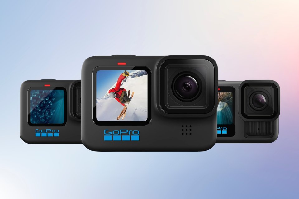 three gopro cameras are lined up on a blue background