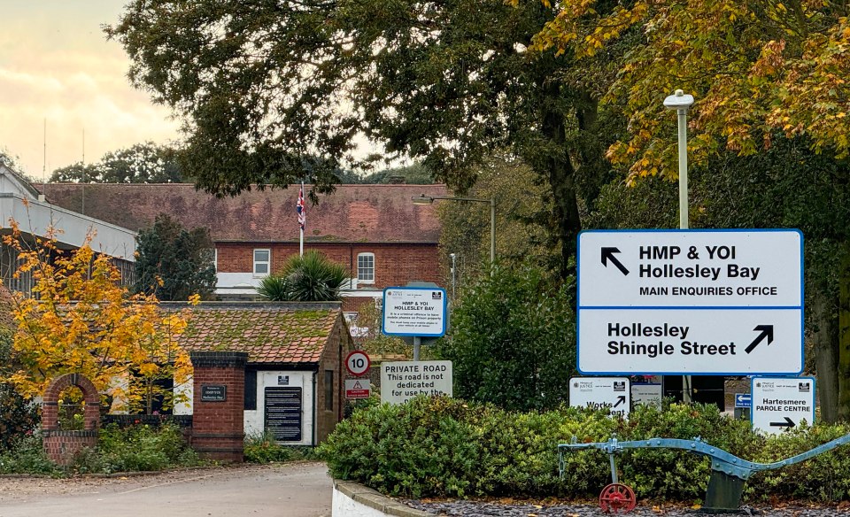 a sign for hmp & yoi hollesley bay main enquiries office