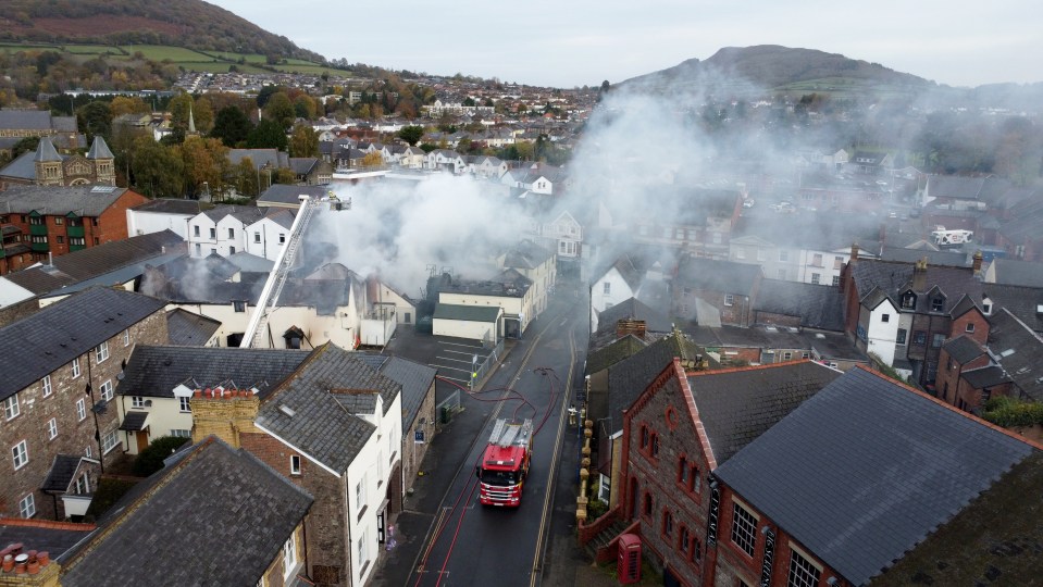 an aerial view of a fire in a small town