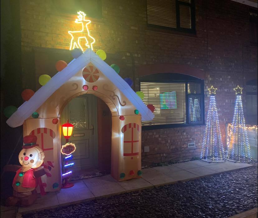 A mother has given her home a festive makeover, using light-up trees and huge inflatables