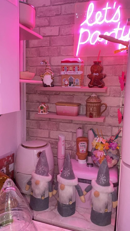 a kitchen with a neon sign that says let 's party