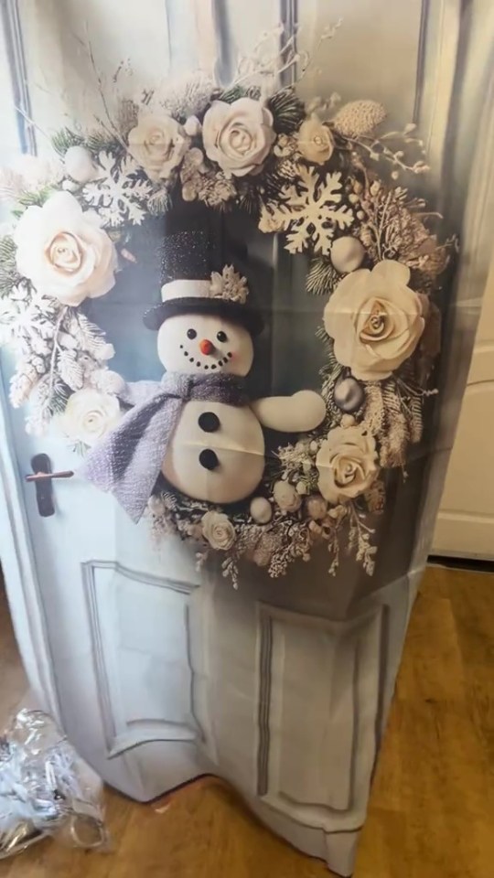 Much to her surprise, the Xmas must-have was actually a festive door banner