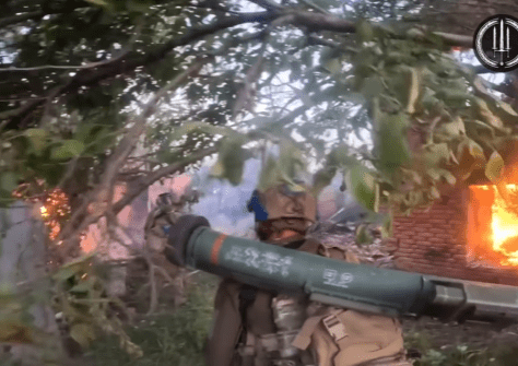 The heavily-armed special ops soldiers walking through blazing homes