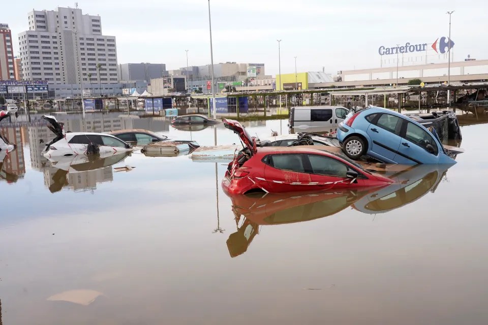 Cars are seen half submerged on Friday