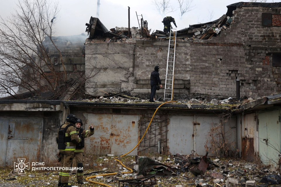 Emergency services at the scene of a damaged building in Dnipro