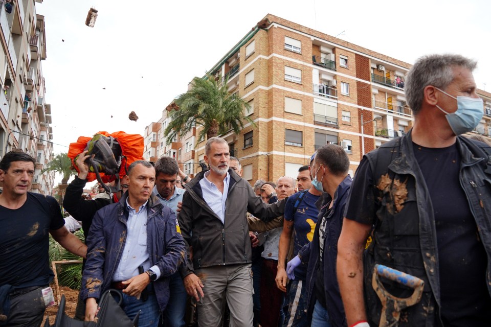 Spain's King walked through the ravaged streets of Paiporta as mud was thrown at him