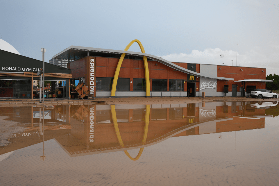 Floodwater stands in front of a McDonald’s after flooding