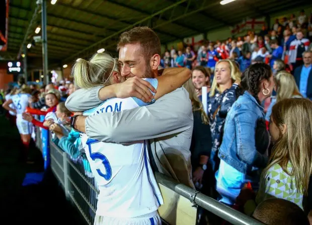 Darby and Houghton embracing after a match