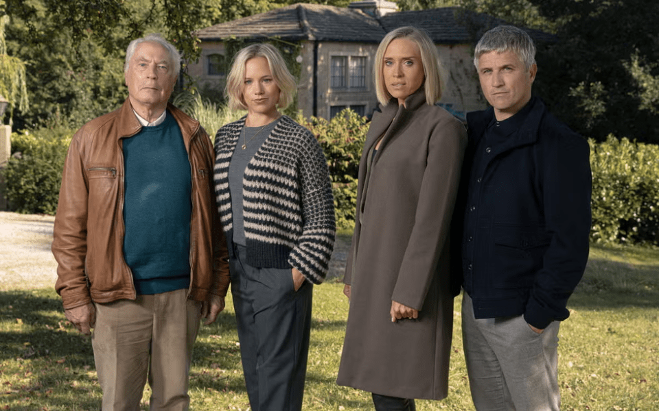 a group of people standing in front of a house