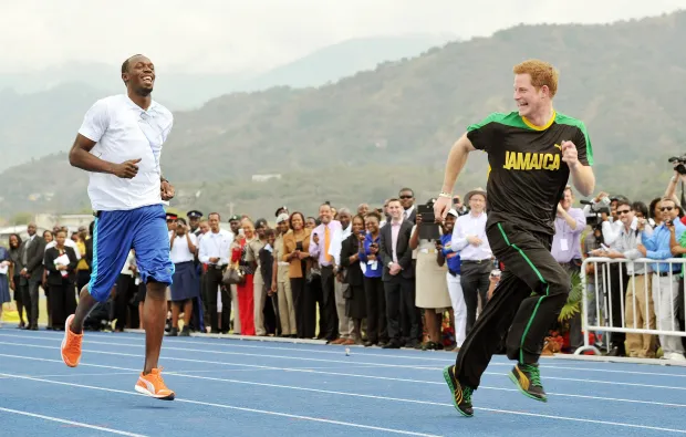 Prince Harry 'winning' an Olympic sprint against runner Usain Bolt in Jamaica in 2012