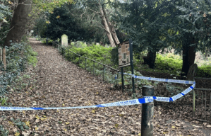 a fence is surrounded by police tape that says do not cross