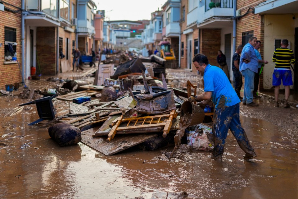 Spaniards are now cleaning up after terrible rain hit Valencia