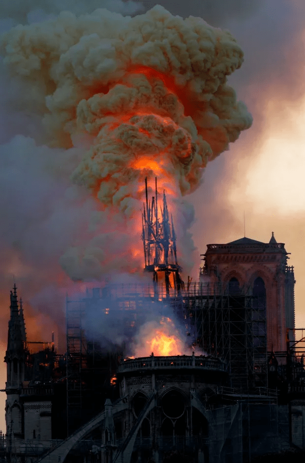 Flames and smoke are seen billowing from the roof at Notre-Dame Cathedral on April 15, 2019