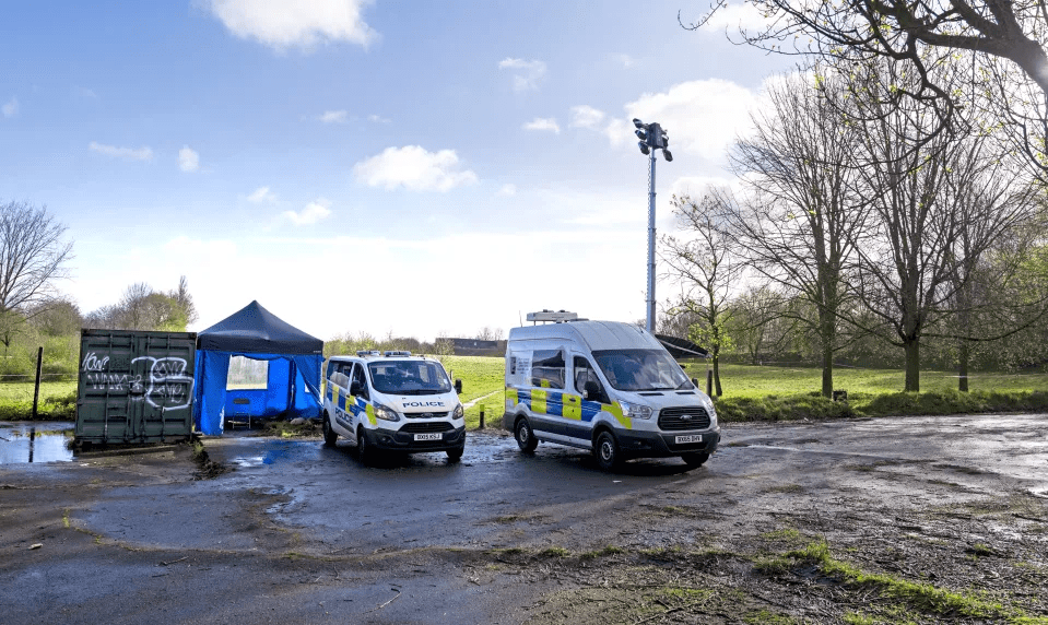 two police vans are parked next to each other