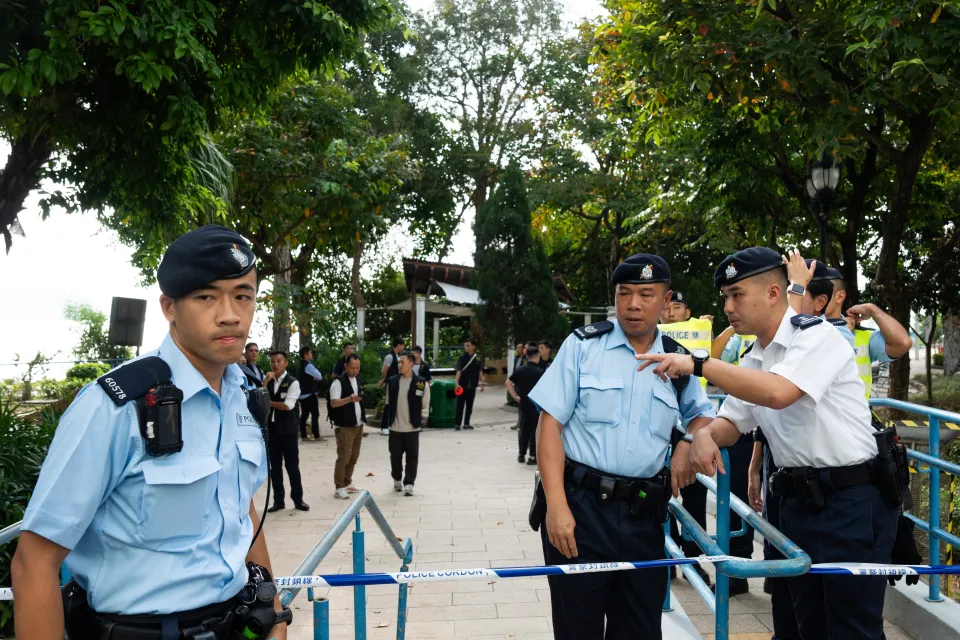 Police officers cordon off the waterfall park where a woman’s body was found