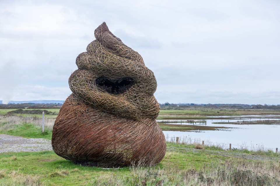 a large sculpture in the shape of a cone with a hole in the middle