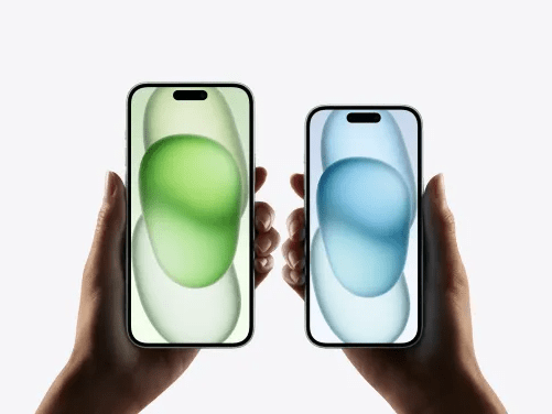 a person is holding two cell phones in their hands