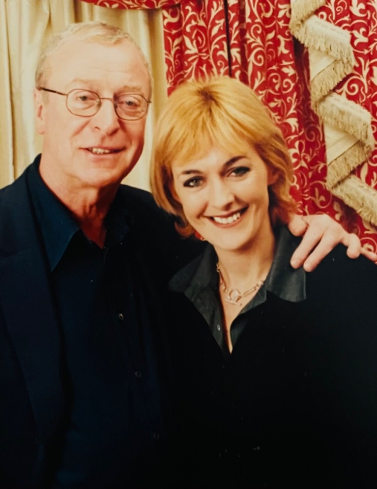 a man and a woman are posing for a picture together