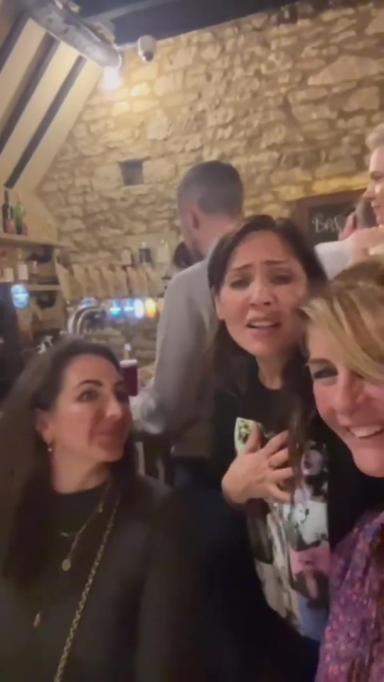 a group of women are standing next to each other in a restaurant .