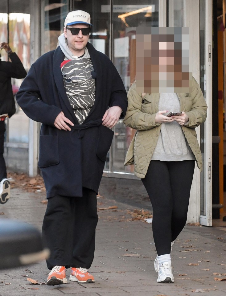 The star cut a casual figure as he walked along with his girlfriend