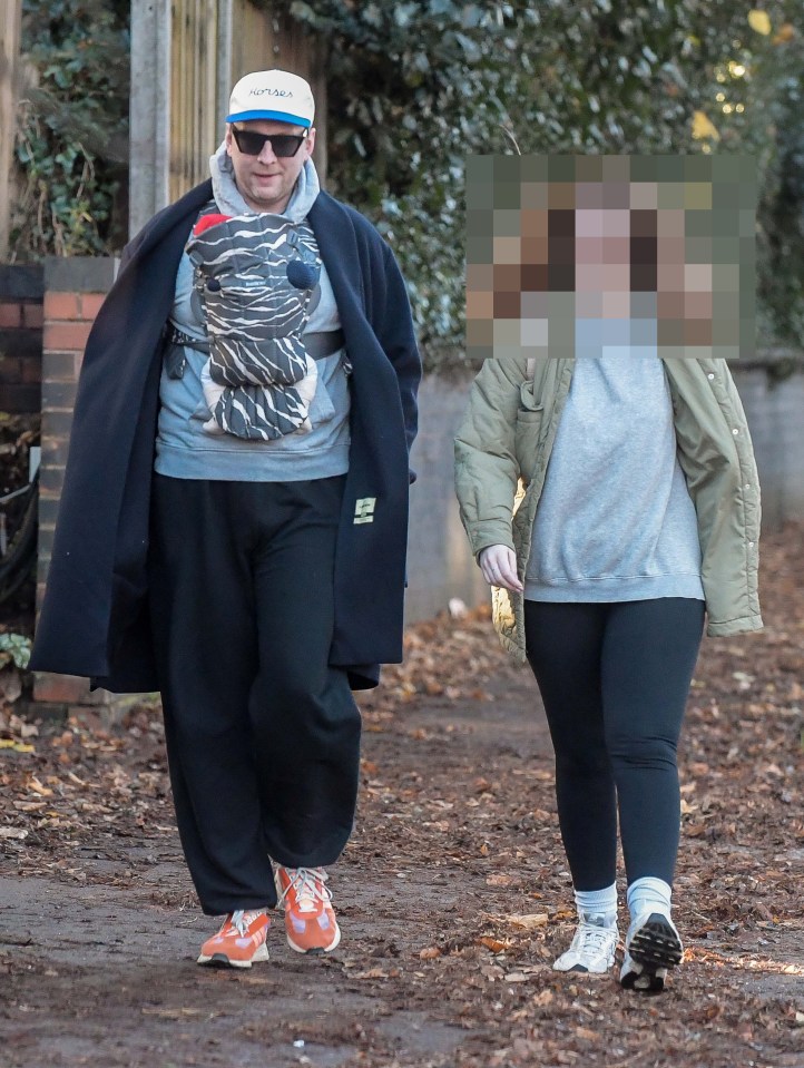 Comedian Joe Lycett has been spotted out for a walk with his mystery girlfriend and newborn son for the first time, after his baby news came like a bolt from the blue last month