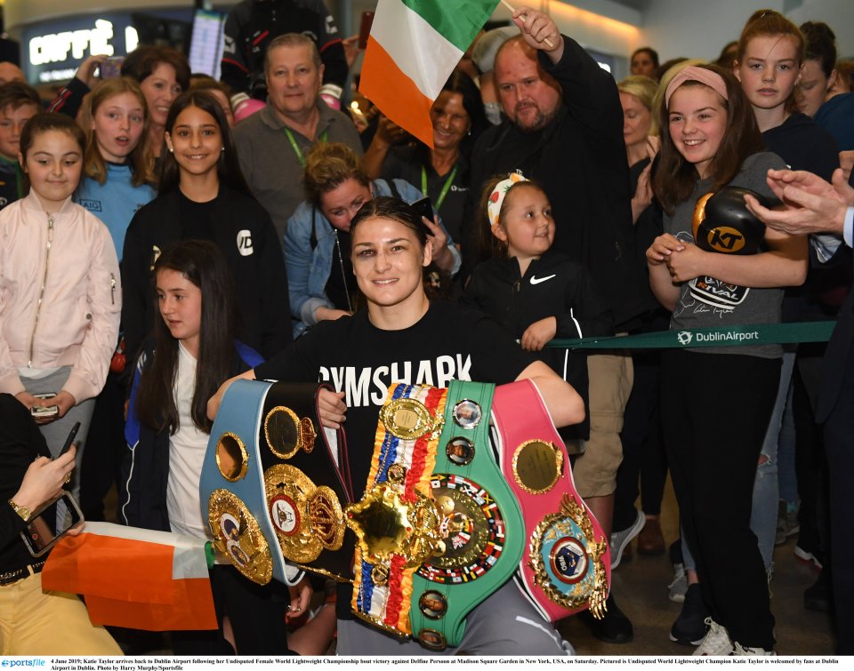 Katie Taylor arrived back to a heroes welcome at Dublin airport after becoming undisputed