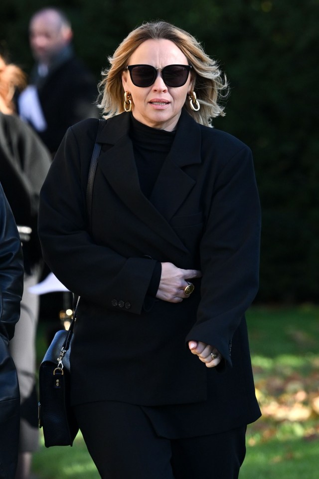 a woman wearing sunglasses and a black jacket