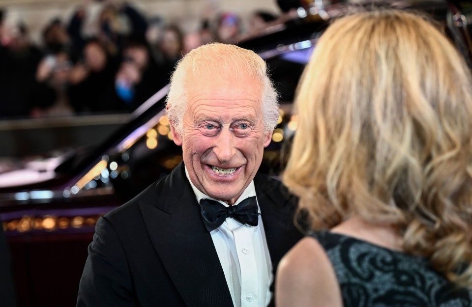 Charles beamed as he stepped out onto the red carpet