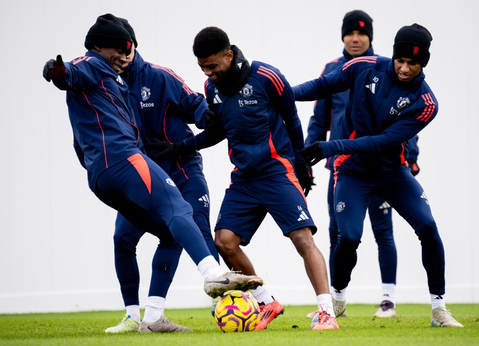 a group of soccer players wearing adidas jackets