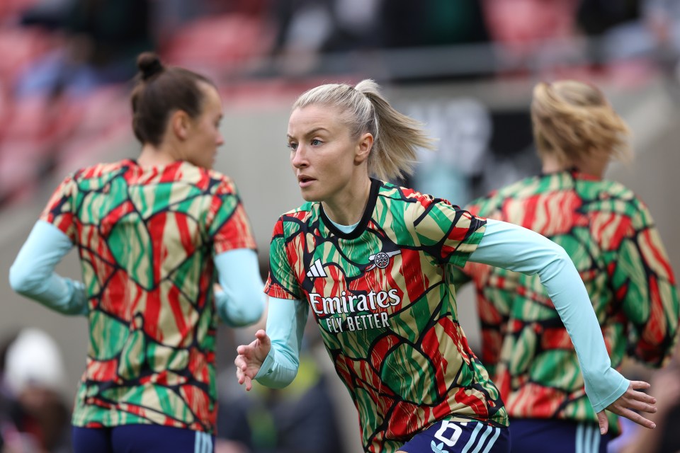 a female soccer player wears a jersey that says emirates fly better