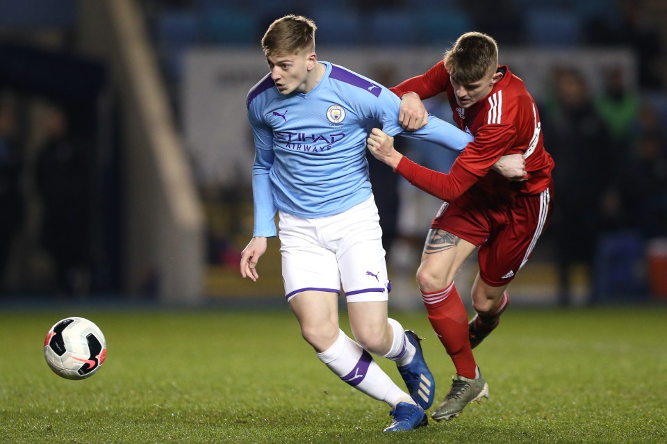 Liam Delap of Manchester City and Luca Murphy of Fulham FC vying for the ball during an FA Youth Cup match.