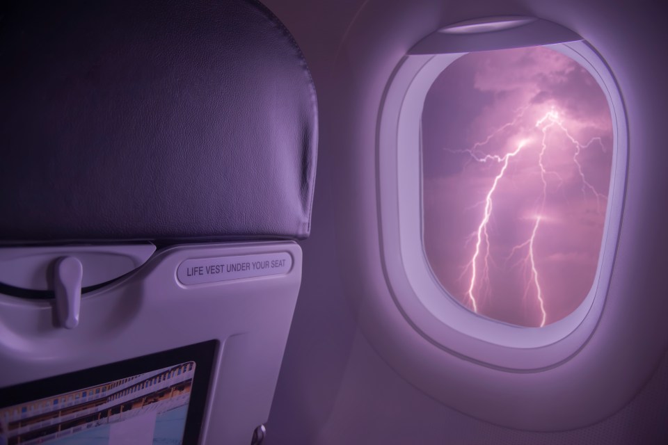 an airplane seat with a life vest under your seat