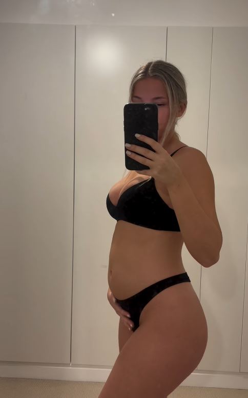 Ella showed off her growing stomach in her underwear