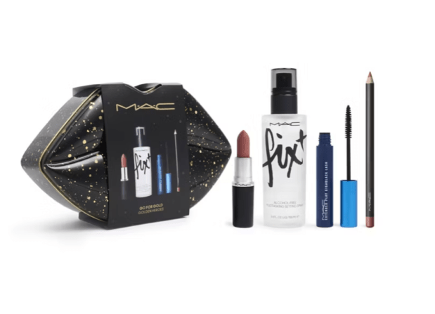 a bottle of mac fix sits next to a lipstick and mascara