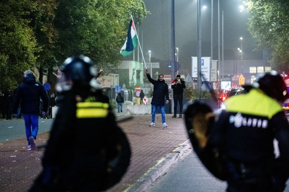 A protester with a Palestinian flag in Amsterdam