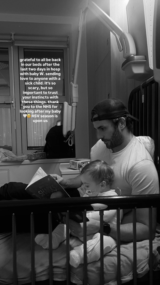 a man reading a book to a baby in a hospital bed