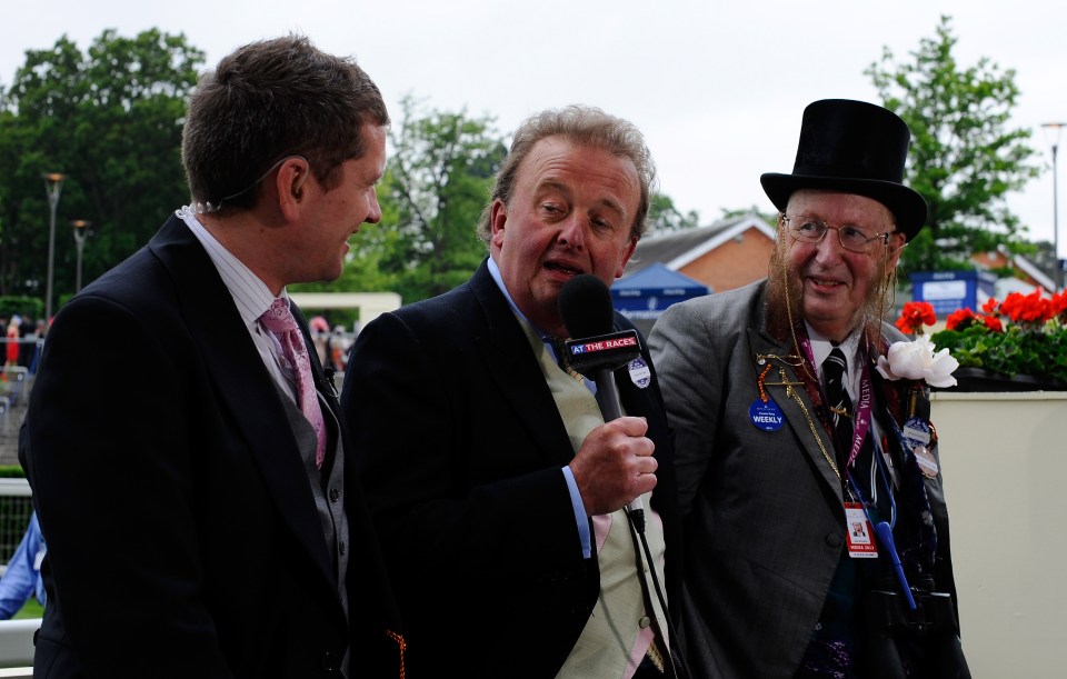 a man with a microphone that says sky on it