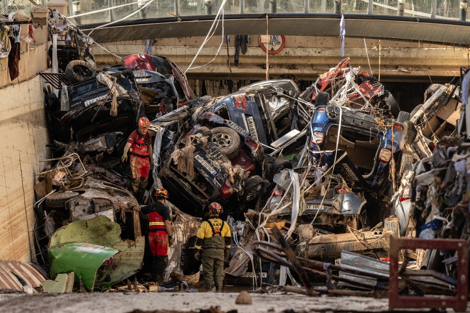 Rescue teams searching flipped over cars as they continue to look for any bodies