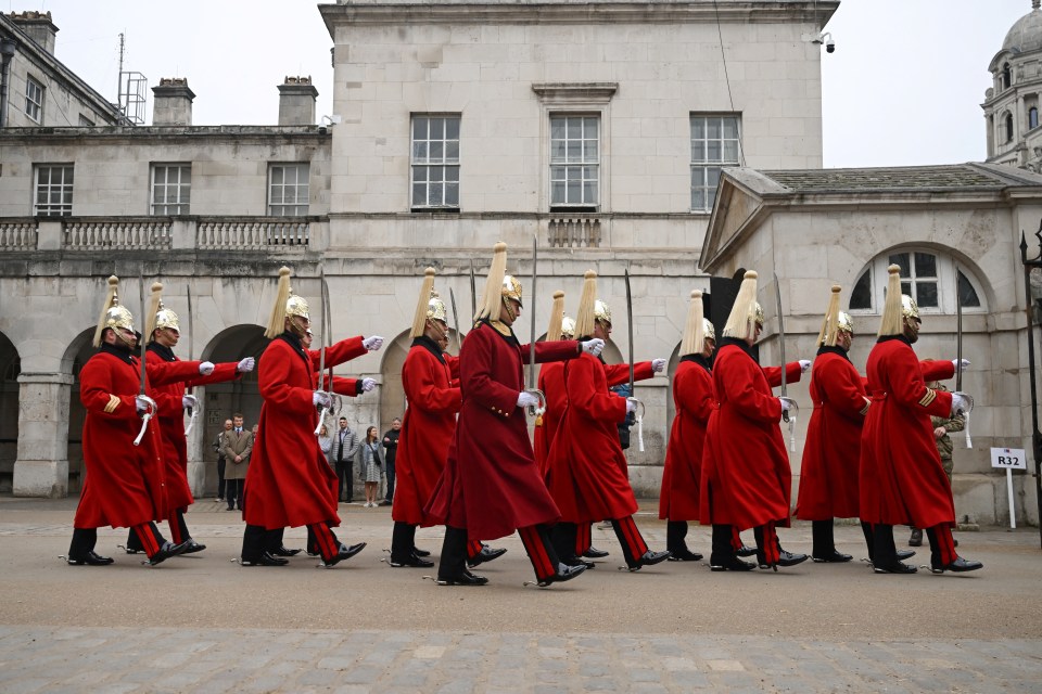 Members of the Life Guards march at the Horse Guards Parade