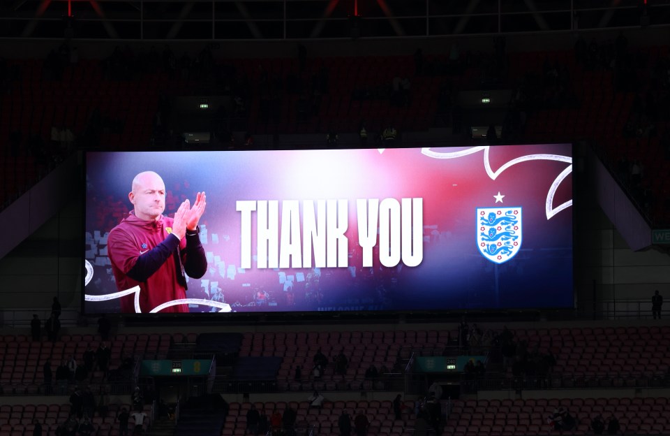 a large screen in a stadium says thank you