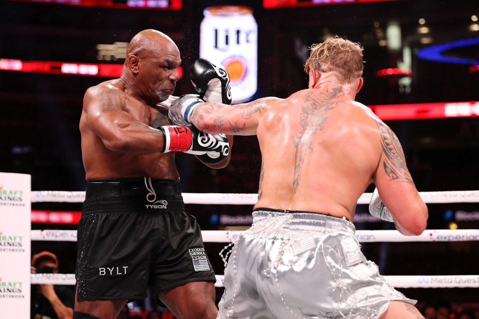 two boxers in a ring with one wearing bylt shorts