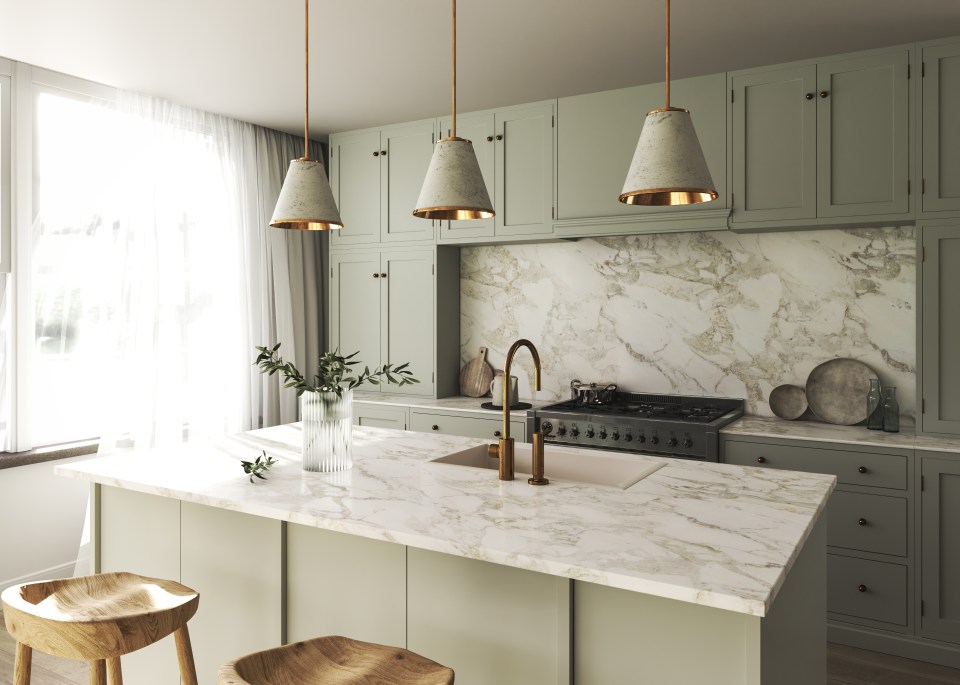 a kitchen with green cabinets and marble counter tops