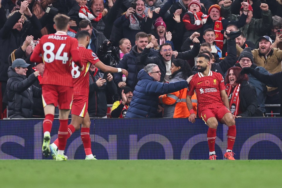 He celebrated with Reds fans after sending his side well clear of Man City