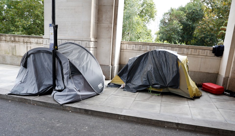 Tents are gathered on the terrace near the Strand in Westminster, London