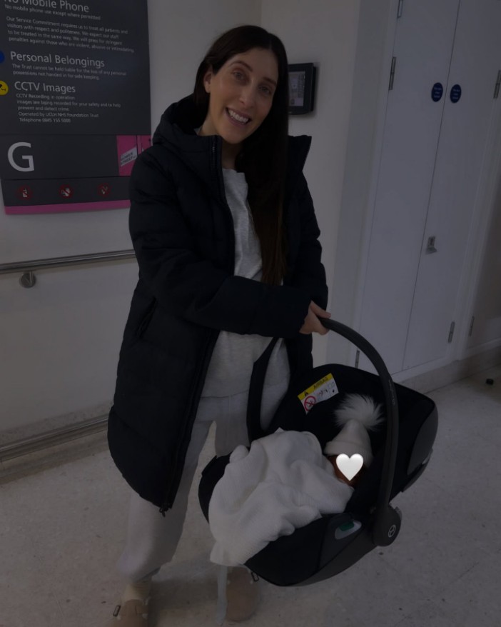 The mum-of-two beamed as she left the hospital with her newborn