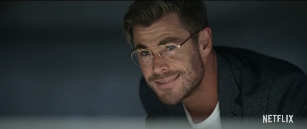 a man wearing glasses is smiling in a netflix ad